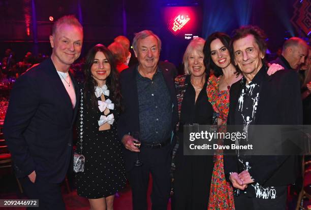 Gary Kemp, Lauren Kemp, Nick Mason, Annette Mason, Sally Wood and Ronnie Wood attend the "Rise Up For The Roundhouse" fundraising gala at The...