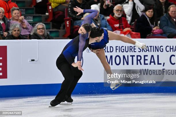 Deanna Stellato-Dudek and Maxime Deschamps of Canada compete in the Pairs Short Program during the ISU World Figure Skating Championships at the Bell...