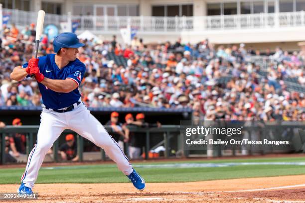 Wyatt Langford of the Texas Rangers bats during a spring training game against the San Francisco Giants at Surprise Stadium on February 25, 2024 in...