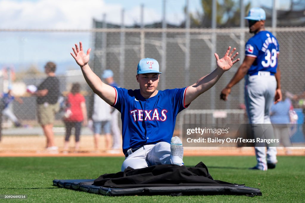 Texas Spring Training Justin Foscue of the Texas Rangers does slide drills during a spring ...