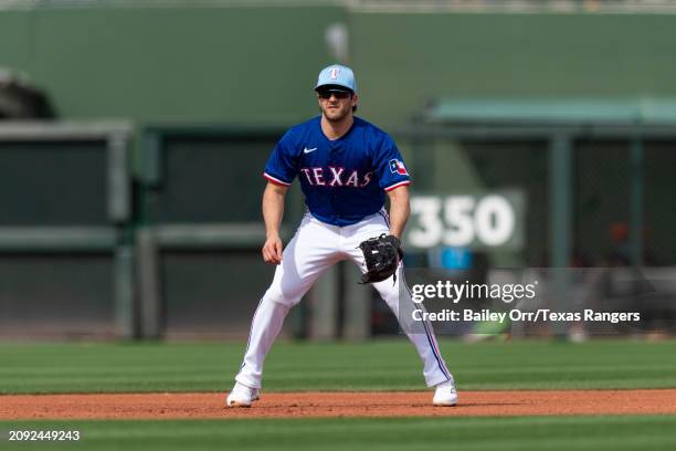 Josh Smith of the Texas Rangers gets set during a spring training game against the San Francisco Giants at Surprise Stadium on February 25, 2024 in...