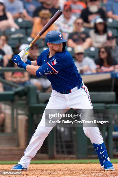 Sam Huff of the Texas Rangers bats during a spring training game against the San Francisco Giants at Surprise Stadium on February 25, 2024 in...