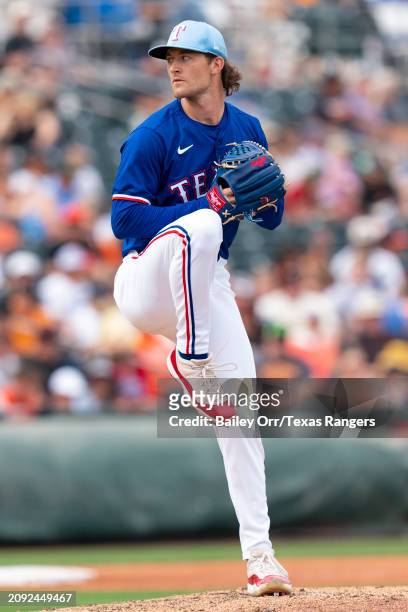 Jake Latz of the Texas Rangers pitches during a spring training game against the San Francisco Giants at Surprise Stadium on February 25, 2024 in...