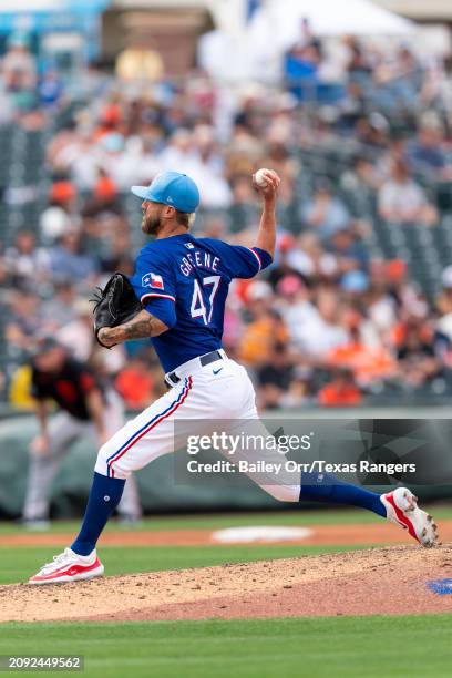 Shane Greene of the Texas Rangers pitches during a spring training game against the San Francisco Giants at Surprise Stadium on February 25, 2024 in...