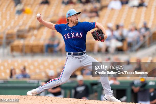 Daniel Robert of the Texas Rangers pitches during a spring training game against the Chicago White Sox at Camelback Ranch on February 26, 2024 in...