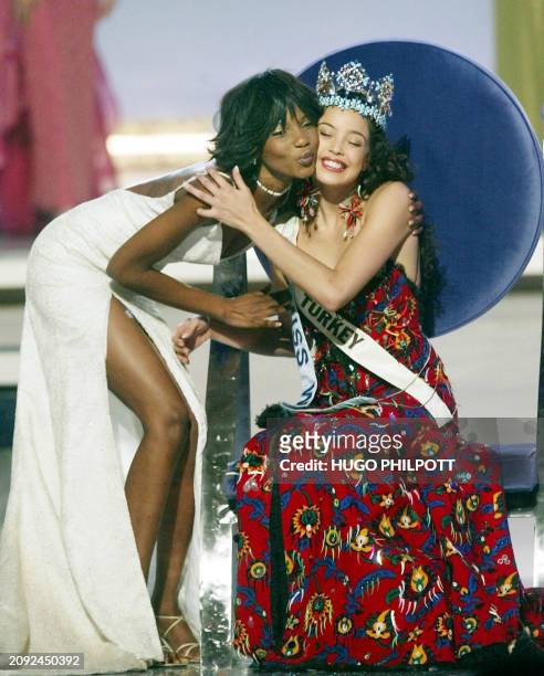 Miss Turkey Azra Akin is crowned 2002 Miss World by last year's winner Nigeria's Agbani Darego 07 December 2002, at the Alexandra Palace. Ninety two...