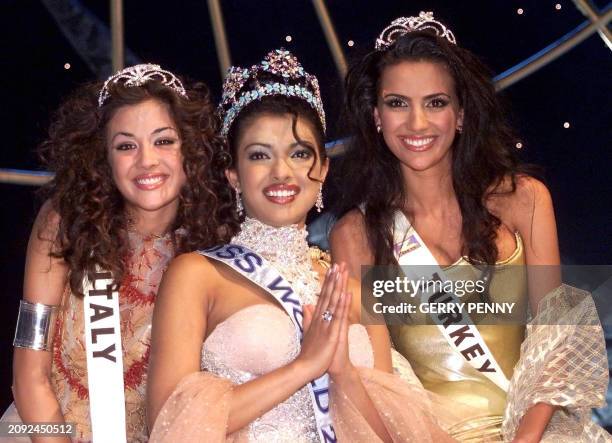 Year-old Priyanka Chopra of India poses after winning the Miss World final with second placed 18-year-old Giorgia Palmas and third placed 20-year-old...