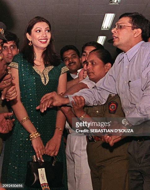 Miss World Yukta Mookhey from the central surburbs of Bombay, arrives 15 December 1999 at Bombay International airport. Large crowds gathered at the...