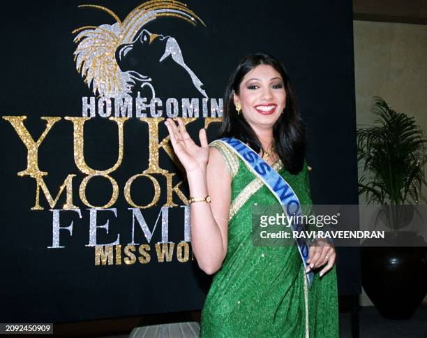 Miss World, Yukta Mookhey, waves during a news conference in New Delhi 23 December, 1999. The 20-year-old Mookhey said she would work for...