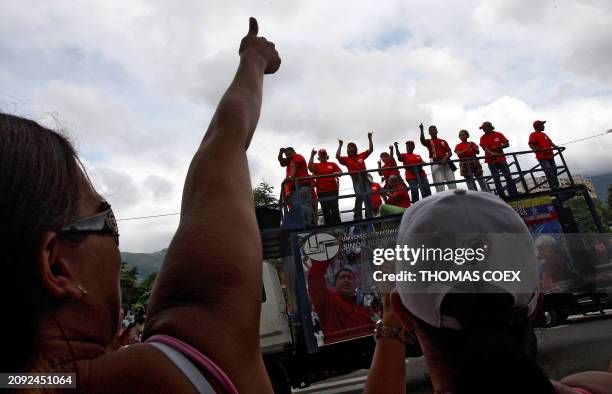 Supporters of Venezuela's President Hugo Chavez celebrate in a street of a densely populated neighborhood in Caracas during municipal elections on...
