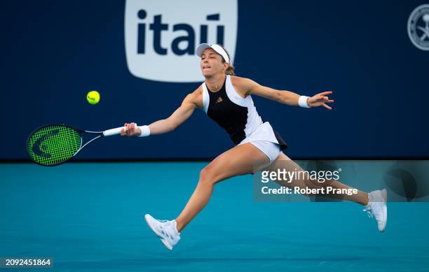 Katie Volynets of the United States in action against Sofia Kenin of the United States in their first round match on Day 5 of the Miami Open...