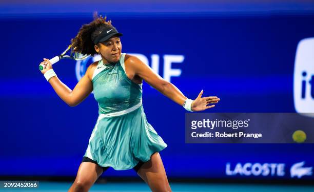 Naomi Osaka of Japan in action against Elisabetta Cocciaretto of Italy in their first round match on Day 5 of the Miami Open Presented by Itau at...