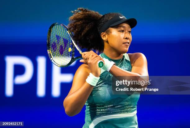 Naomi Osaka of Japan in action against Elisabetta Cocciaretto of Italy in their first round match on Day 5 of the Miami Open Presented by Itau at...