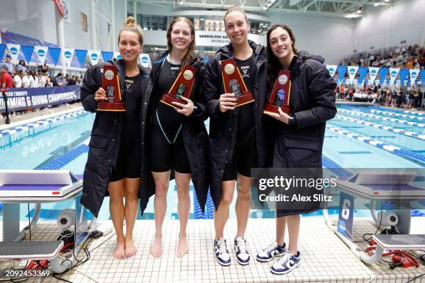 Carly Novelline, Maxine Parker, Gretchen Walsh and Jasmine Nocentini of the Virginia Cavaliers pose with the trophy after winning the Women's 200...