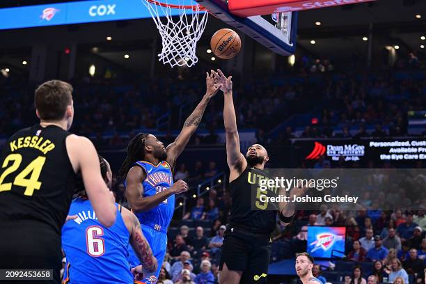 Talen Horton-Tucker of the Utah Jazz puts up a shot against Cason Wallace of the Oklahoma City Thunder during the first half at Paycom Center on...