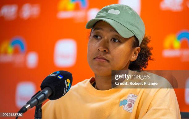 Naomi Osaka of Japan talks to the media after defeating Elisabetta Cocciaretto of Italy in the first round on Day 5 of the Miami Open Presented by...