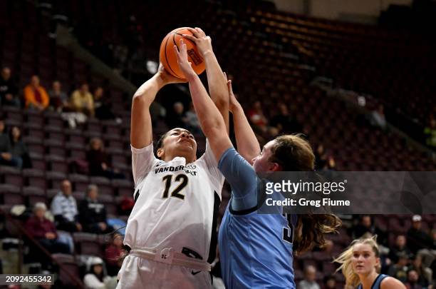 Khalil Pierre of the Vanderbilt Commodores drives to the basket in the first half against Cecelia Collins of the Columbia Lions during the First Four...