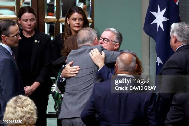Australian Prime Minister Anthony Albanese embraces former Labor Party minister Joel Fitzgibbon after speaking about the death of his son Jack...