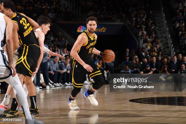 Klay Thompson of the Golden State Warriors dribbles the ball during the game against the Memphis Grizzlies on March 20, 2024 at Chase Center in San...