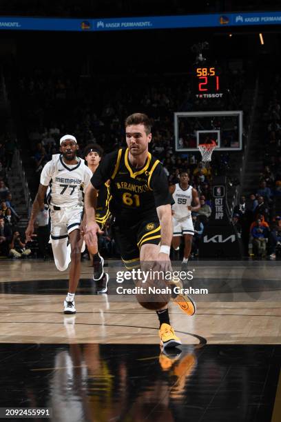 Pat Spencer of the Golden State Warriors drives to the basket during the game against the Memphis Grizzlies on March 20, 2024 at Chase Center in San...