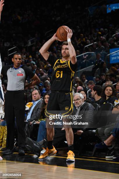 Pat Spencer of the Golden State Warriors looks to pass the ball during the game against the Memphis Grizzlies on March 20, 2024 at Chase Center in...