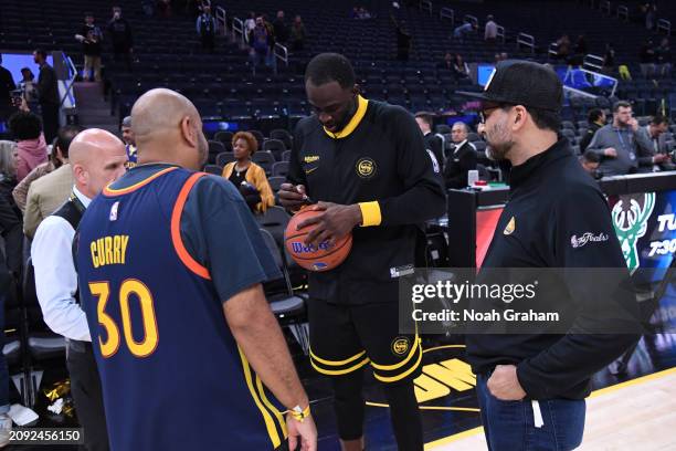 Draymond Green of the Golden State Warriors signs autographs after the game against the Memphis Grizzlies on March 20, 2024 at Chase Center in San...