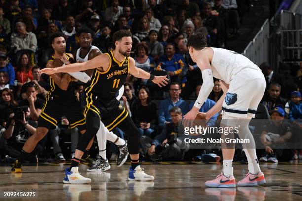 Klay Thompson of the Golden State Warriors plays defense against the Memphis Grizzlies on March 20, 2024 at Chase Center in San Francisco,...