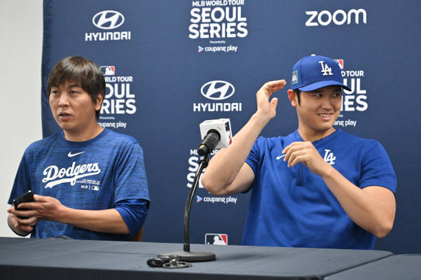 This picture taken on March 16, 2024 shows Los Angeles Dodgers' Shohei Ohtani and his interpreter Ippei Mizuhara attending a press conference at...