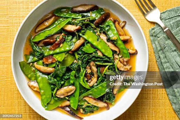 Watercress, Snow Pea and Shiitake Mushroom Stir-Fry photographed for Food in Washington, DC on March 19, 2024.
