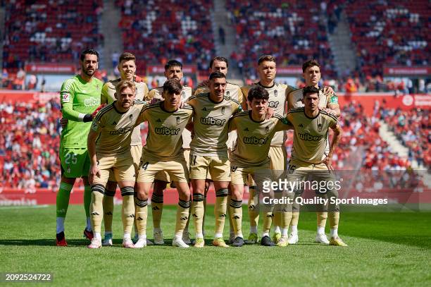 Players of Granada CF line up for a team photo prior to the LaLiga EA Sports match between RCD Mallorca and Granada CF at Estadi de Son Moix on March...