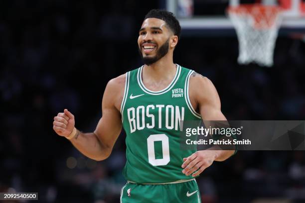 Jayson Tatum of the Boston Celtics celebrates against the Washington Wizards during the second half at Capital One Arena on March 17, 2024 in...