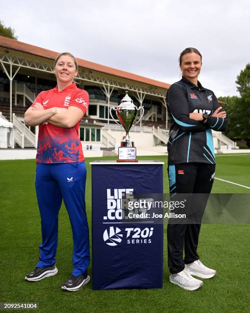 Heather Knight of England and Suzie Bates of New Zealand pose for a photo with the series trophy during the New Zealand White Ferns v England Womens...