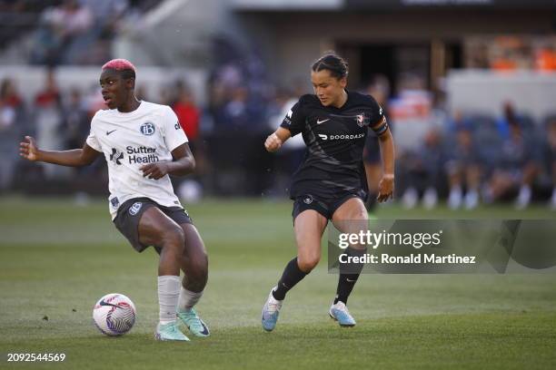 Asisat Oshoala of Bay FC controls the ball against Ali Riley of Angel City FC in the first half at BMO Stadium on March 17, 2024 in Los Angeles,...