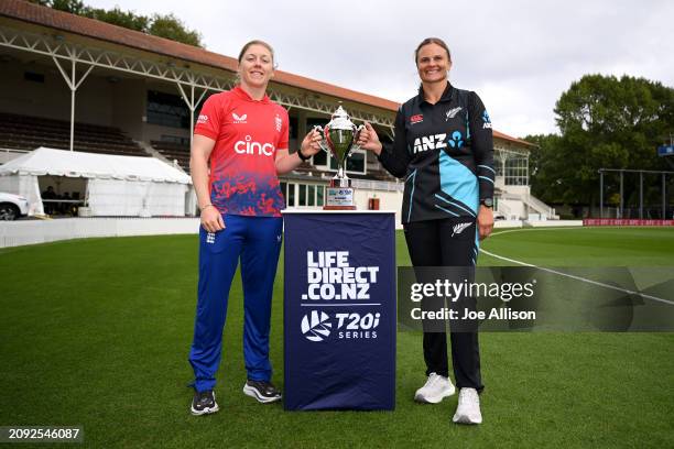 Heather Knight of England and Suzie Bates of New Zealand pose for a photo with the series trophy during the New Zealand White Ferns v England Womens...