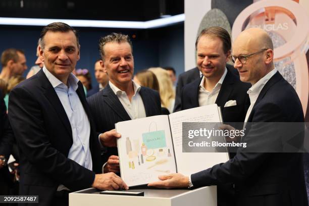 Sander van der Laan, chief executive officer of Douglas AG, Henning Kreke, chairman of the supervisory board of Douglas AG, Philipp Andree, chief...