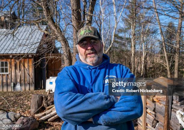 Pat LeClaire stands in front of his sugar house where he uses wood-fired heat to boil maple sap collected from nearby maple trees March 8, 2024 in...