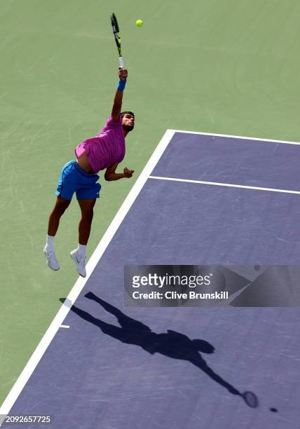 Carlos Alcaraz of Spain serves against Daniil Medvedev in the Men's Final during the BNP Paribas Open at Indian Wells Tennis Garden on March 17, 2024...