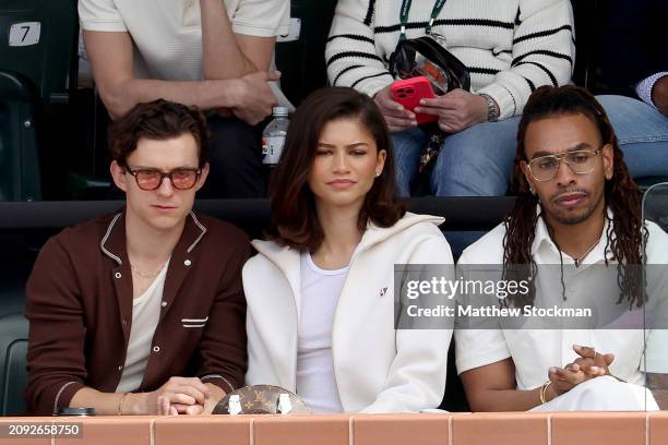 Tom Holland and Zendaya watch Carlos Alcaraz of Spain play Daniil Medvedev of Russia during the Men's Final of the BNP Paribas Open at Indian Wells...