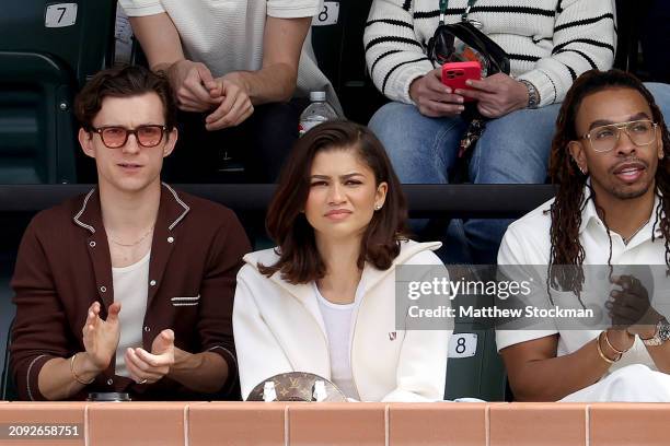 Tom Holland and Zendaya watch Carlos Alcaraz of Spain play Daniil Medvedev of Russia during the Men's Final of the BNP Paribas Open at Indian Wells...