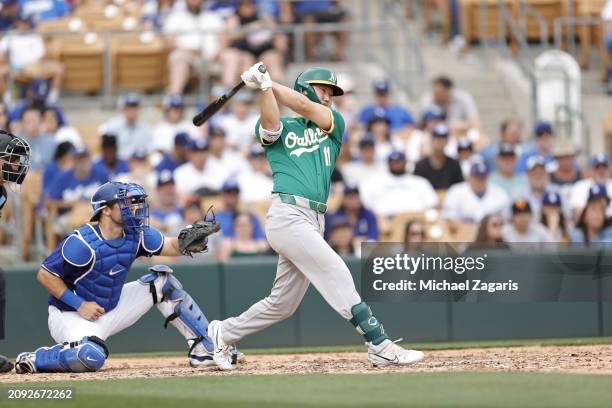 Hoy Park of the Oakland Athletics bats during a spring training game against the Los Angeles Dodgers at Camelback RanchGlendale on February 25, 2024...