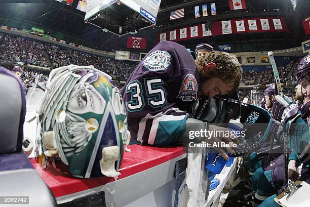 Goaltender Jean-Sebastien Giguere of the Mighty Ducks of Anaheim cools down during a break in play in the final minutes of game five of the 2003...