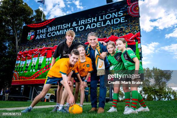 Classic Wallaby and member of the 1989 Combined Australia and New Zealand XV Tim Horan with local Rugby Union junior players Henri Graham Oliver...