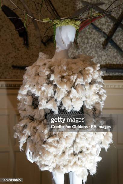 Tufted Nettle Dress made from Highgrove and Sandringham nettle and a recycled yarn mesh dress, on display during a preview of the Vin + Omi and King...