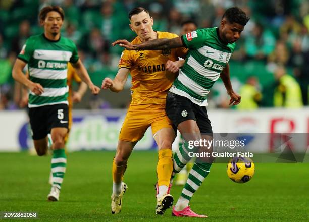 Matheus Reis of Sporting CP with Robert Bozenik of Boavista FC in action during the Liga Portugal Betclic match between Sporting CP and Boavista FC...