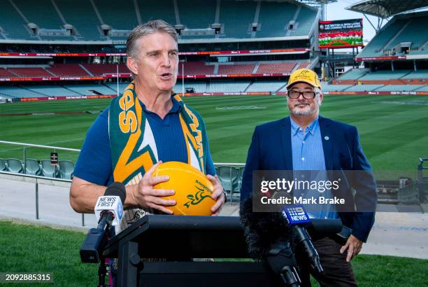 Classic Wallaby and member of the 1989 Combined Australia and New Zealand XV Tim Horan speaks to media flanked by Member for Mawson Leon Bignell MP...