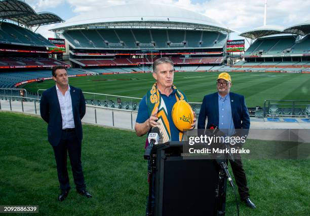 Classic Wallaby and member of the 1989 Combined Australia and New Zealand XV Tim Horan speaks to media flanked by Member for Mawson Leon Bignell MP...