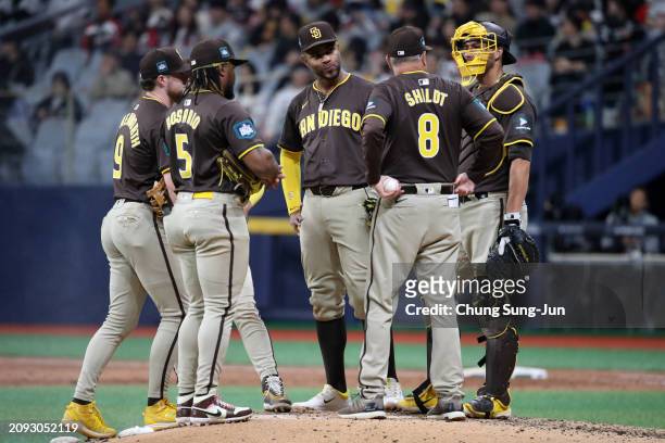 Manager Mike Shildt of the San Diego Padres visits the mound to call a pitching change in the 6th inning during the exhibition game between San Diego...