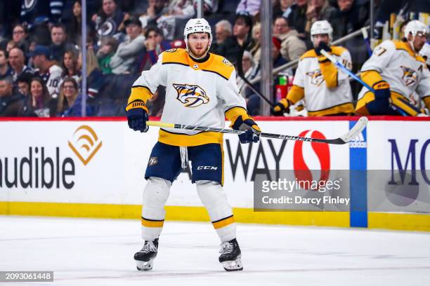 Jeremy Lauzon of the Nashville Predators keeps an eye on the play during third period action against the Winnipeg Jets at the Canada Life Centre on...