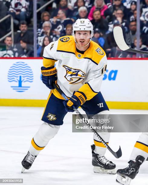 Gustav Nyquist of the Nashville Predators keeps an eye on the play during third period action against the Winnipeg Jets at the Canada Life Centre on...