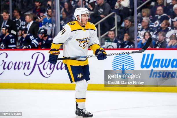 Gustav Nyquist of the Nashville Predators keeps an eye on the play during second period action against the Winnipeg Jets at the Canada Life Centre on...
